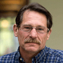 Headshot of Professor Bradley Reed
