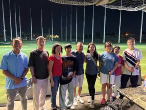 Photos of alumni at the TopGolf social