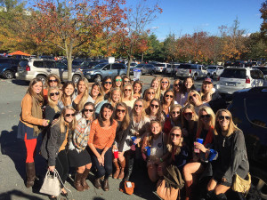 Recent Theta grads show their love for the Hoos at the Homecoming game against Syracusre on Saturday, October 17.