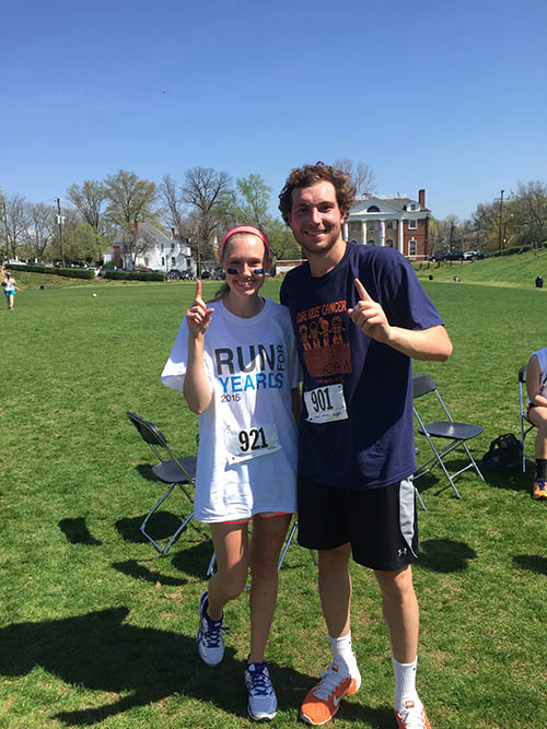 First place girl and boy runners, including Delta Chi Caroline Henzen, pose for a picture to support one love.