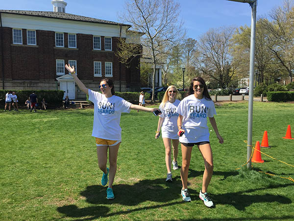 First Years Julia Anello, Grace Mountcastle and Claire Templeman crossing the finish line after the race.