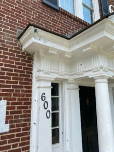image of Theta Chi front door in need of repair