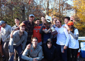 rowing team members lifting the king's cup